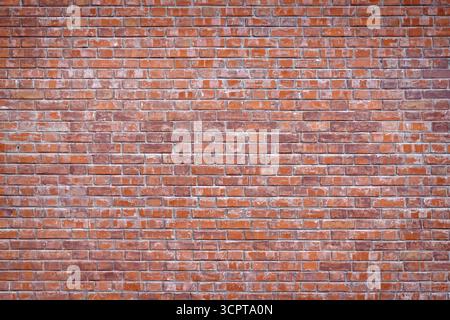 Old red wall from brickwork as background close up Stock Photo