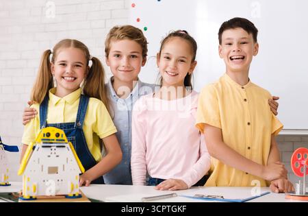 Portrait of pupils building robots in after school stem class Stock Photo