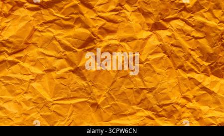 Crumpled Orange Paper Texture with Dimensional Folded Surface Stock Photo