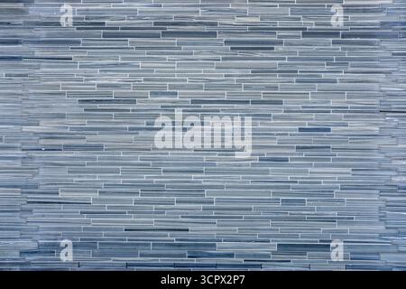 Background from a wall made of small gray stone tiles Stock Photo
