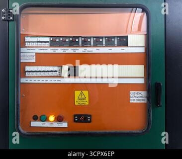 electric breakers in metal box with clear window, buttons and thermometer control panel metal shield box cabinet, Stock Photo