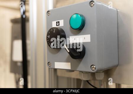 electric panel box with speed control, green light and rotary switch, in an abattoir, industrial systems Stock Photo
