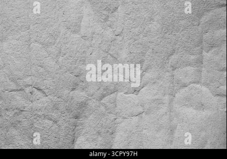 Soft handmade grey paper texture background with gentle subtle folds and creases, minimal elegant surface ideal for backgrounds, stationery, branding Stock Photo