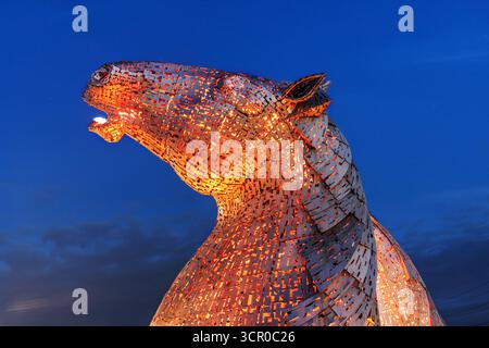 Detail at night of the monumental horse sculptures known as The Kelpies by the sculptor Andy Scott. Built in 2014, they are located between Falkirk an Stock Photo