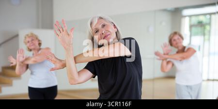 Portrait of an elderly dancing woman practicing vigorous swing Stock Photo