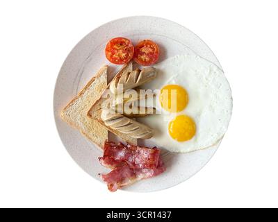 English Breakfast with fried eggs, tomatoes, toast bread and bacon on white plate isolated on white background. Top view. Stock Photo