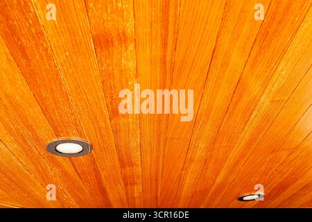 Wooden ceiling with built in ceiling spotlights. Stock Photo