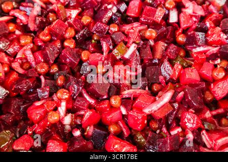 Vinaigrette salad. Salad with diced boiled beetroot vegetables, potatoes, carrots, pickled cucumbers and peas. Stock Photo