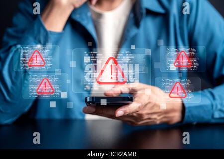 Cybersecurity warning concept with alert, data breach risk, malware attack, and online security Stock Photo