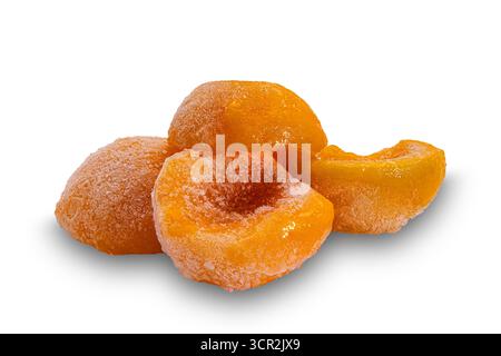 Closeup view of frozen canned peach halves isolated on white background with clipping path. Stock Photo