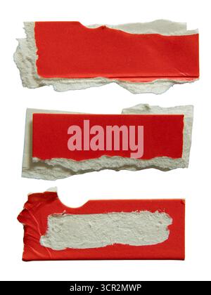 Red paper packaging torn into rectangular pieces isolated on white background with clipping path Stock Photo