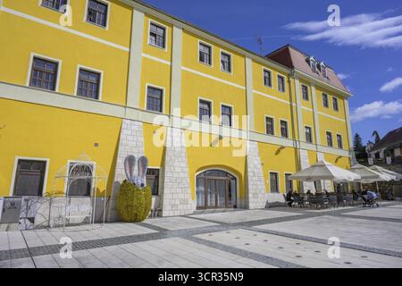 Square in front of old house with cafe and glittering Easter bunny figure, Varasdinske toplice, Varasdin County, Croatia Stock Photo