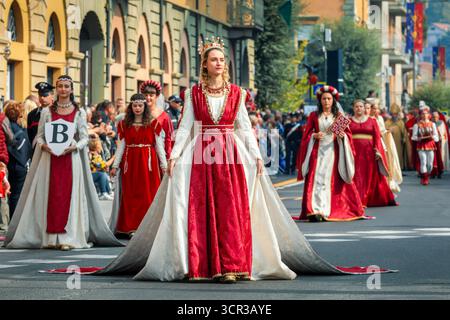Historical reenactors, dressed in elaborate medieval costumes, participate in the annual Sfilata Storica (Historical Parade) in Alba, Italy. Stock Photo