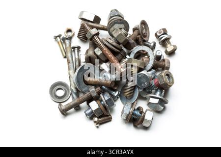 Collection of assorted metal fasteners in various shapes and sizes displayed on a white background Stock Photo