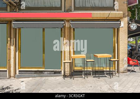 Small café with a sliding glass facade that opens completely on good weather Stock Photo