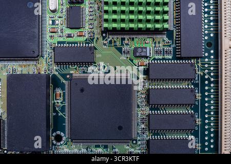Close examination reveals the complex components of a circuit board, essential for advancements in AI and cryptocurrency applications. Stock Photo