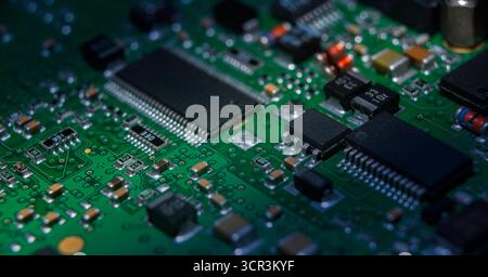 Close-up view of a complex circuit board showcasing various components vital for AI and cryptocurrency applications. Stock Photo