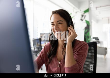 Technical support agent helping to clients troubleshoot technical issues online Stock Photo