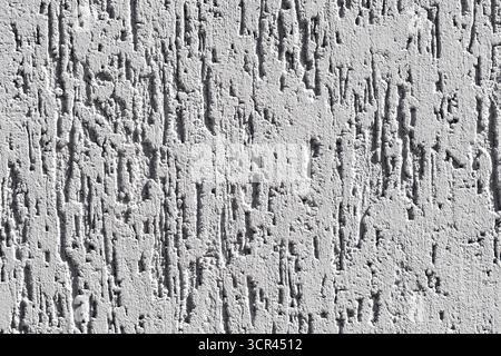 background the wall is plastered with coarse putty with furrows Stock Photo