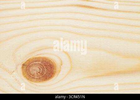background surface of beautiful wooden board close-up with fibers, knot Stock Photo