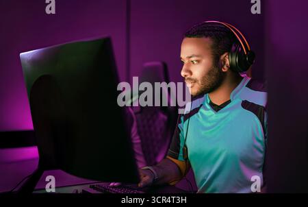 A dedicated gamer competing in esports with a stylish setup that enhances interaction Stock Photo