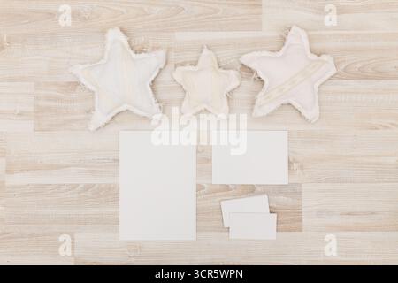 Creative workspace featuring fabric stars and blank papers for craft projects Stock Photo