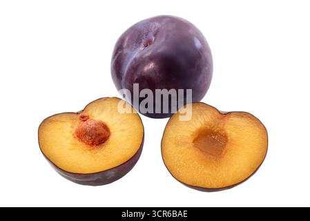 Whole plum and plum cut in half with seed view isolated on white with clipping path included Stock Photo