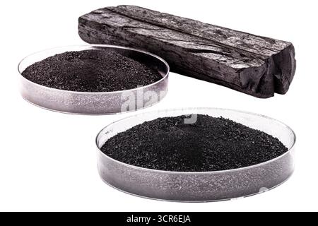 pile of coal dust isolated with piece of charcoal on white background Stock Photo