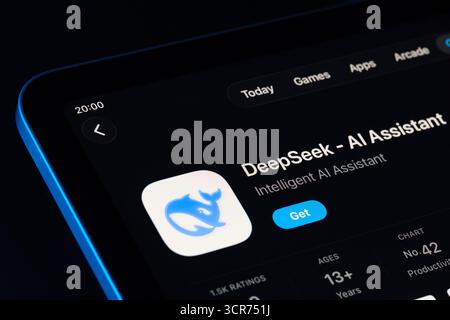 DeepSeek app page on App Store for iPad, Apple Liquid Glass design in iOS 26 showcased with dark mode. Stafford, United Kingdom, September 29, 2025. Stock Photo