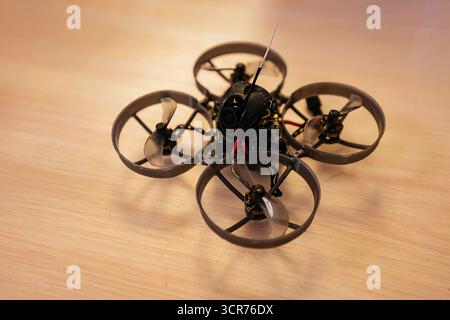 Small fpv drone on table. Stock Photo