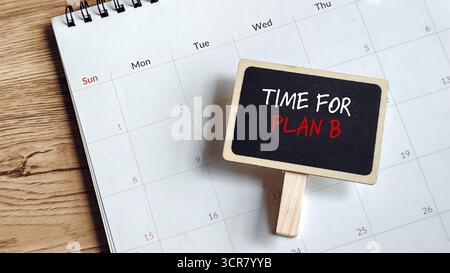 Time For Plan B Concept: Chalkboard Sign on a Calendar Page Showing Alternative or Backup Strategy. Stock Photo
