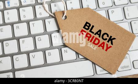 Black Friday Sale Tag on Computer Keyboard Keys Symbolizing Online Shopping and E-commerce Discounts Stock Photo
