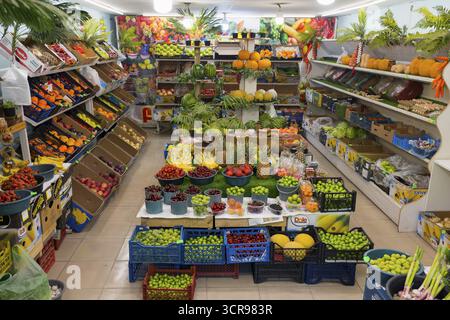 A well-stocked shop full of colourful fruit and vegetables displayed on shelves and tables, Gyumri, Gyumri, Gyumri, Shirak Province, Armenia Stock Photo