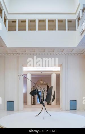 Classic Art Deco interior hall with columned loggia and a central modern black metal sculpture on a circular platform, Serralves Villa, Porto Stock Photo