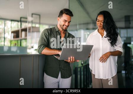 Software engineers using laptop computer with global network connection, Technology, innovation Stock Photo