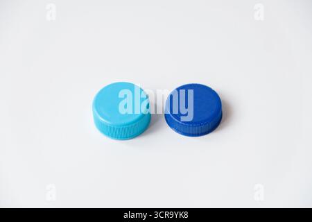 Blue water plastic caps for recycling isolated on white background Stock Photo