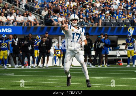 Indianapolis Colts quarterback Daniel Jones (17) grabs his leg after an injury during the first