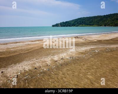 Plastic waste and rubbish washed ashore on a sandy beach in Malaysian Borneo Stock Photo