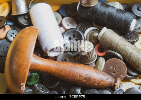 Collection of vintage sewing tools in an old sewing box Stock Photo