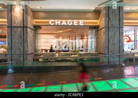 Seating area for customers to enjoy low calorie drinks at Chagee, Orchard Central. Tea business drinks company from China opened in Singapore. Stock Photo