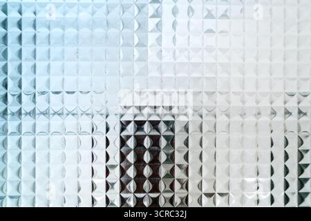Closeup of frosted textured glass with repeating geometric square and diamond pattern Stock Photo