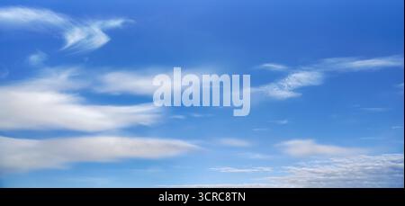 Bright blue sky with fine cirrus clouds, abstract nature background Stock Photo