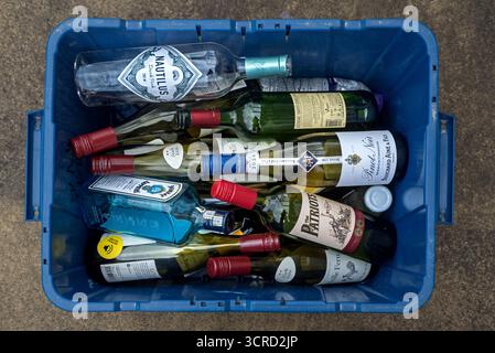 Blue box of glass bottles waiting to be collected as part of the City of Edinburgh Council's recycling scheme. Stock Photo