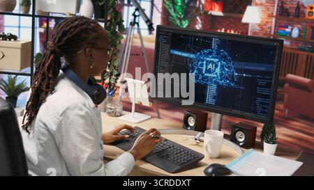 Overjoyed programmer happily clapping hands after finishing maintenance on neural networks. IT expert doing ecstatic fist pump in air hand gesture after successful checkup on AI systems, camera B Stock Photo