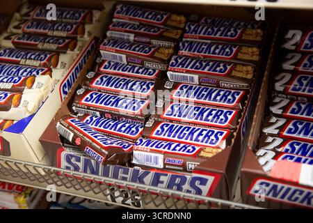 Los Angeles, California, United States - 07-22-2020: A view of a case of several Snickers candy bars, on display at a local grocery store. Stock Photo
