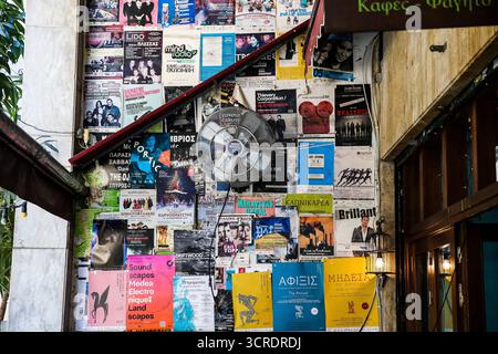 Urban collage of torn posters and flyers in the heart of Athens, Greece Stock Photo