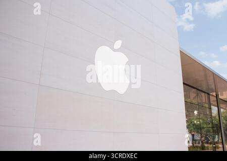Irvine, California, United States - 09-01-2020: A view of the Apple logo on the side of one of its retail stores at the Irvine Spectrum. Stock Photo
