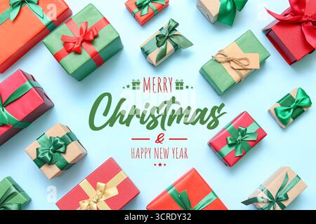 Greeting card for Christmas and New Year with many gifts on light blue background Stock Photo