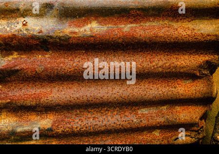 An old and rusty corrugated tin roof panel. Stock Photo