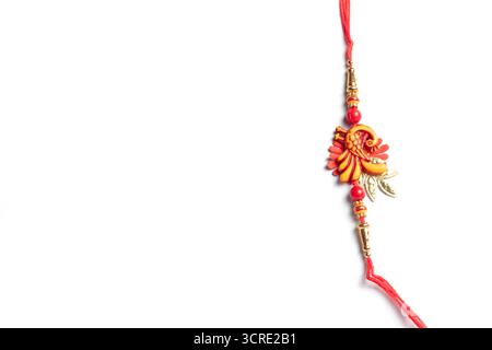 A vibrantly colorful Rakhi decoration representing the traditional Indian festival of Raksha Bandhan. Isolated on a white background, highlighting the Stock Photo
